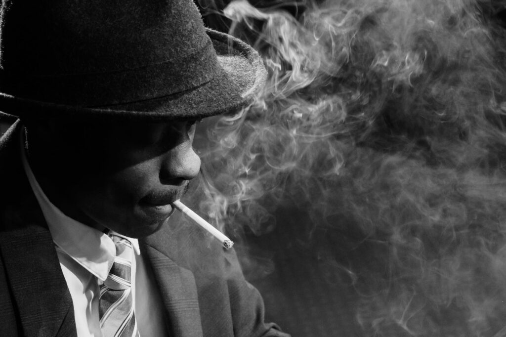 close up photo of man smoking cigarette